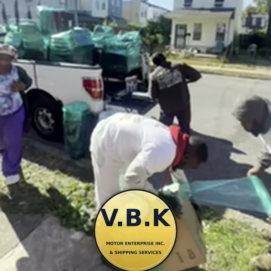 V.B.K Motor Enterprise Inc. & Shipping Services pickup truck loaded with wrapped customer cargo while the team finishes wrapping
